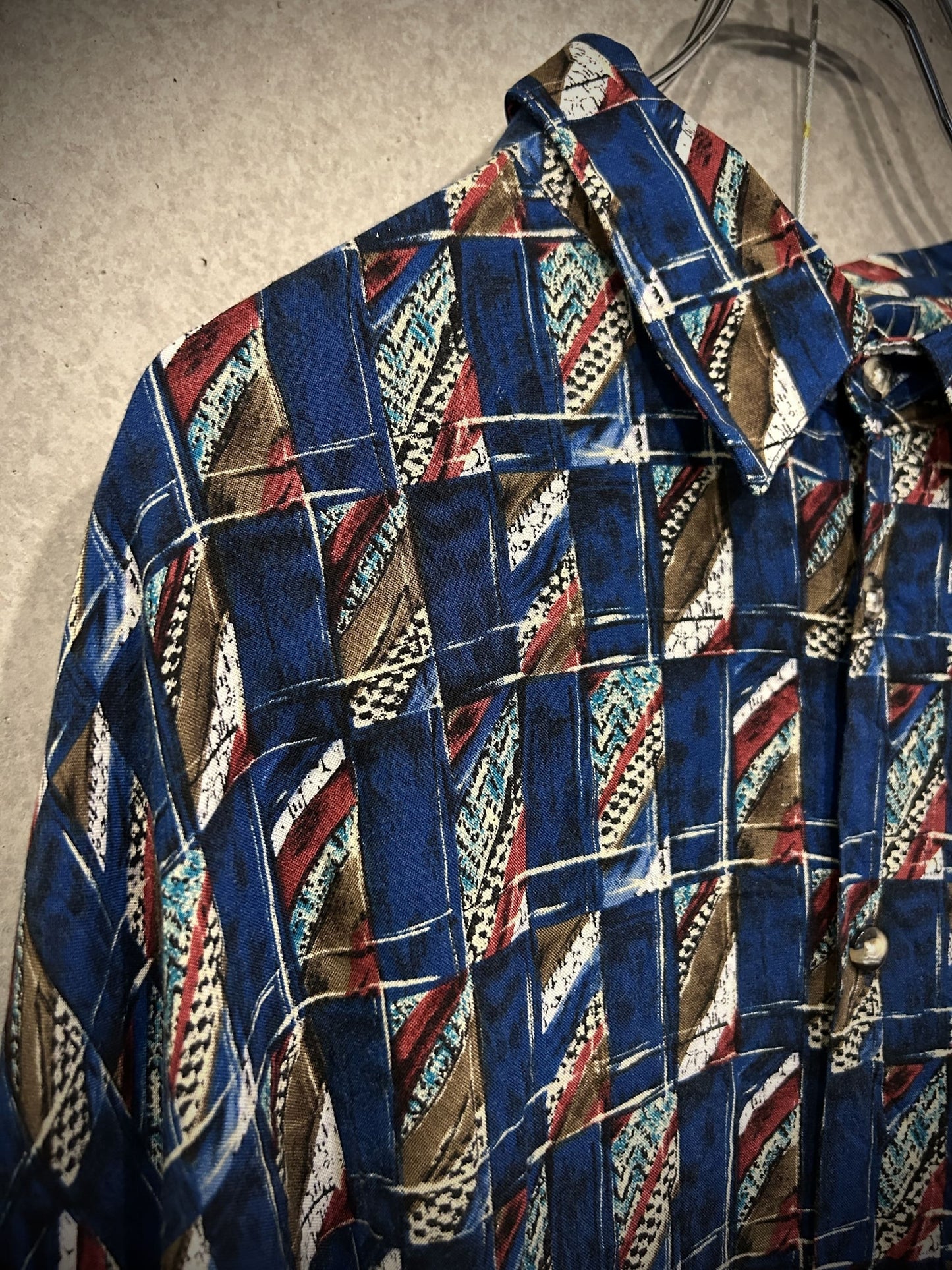 blue geometric pattern shirt